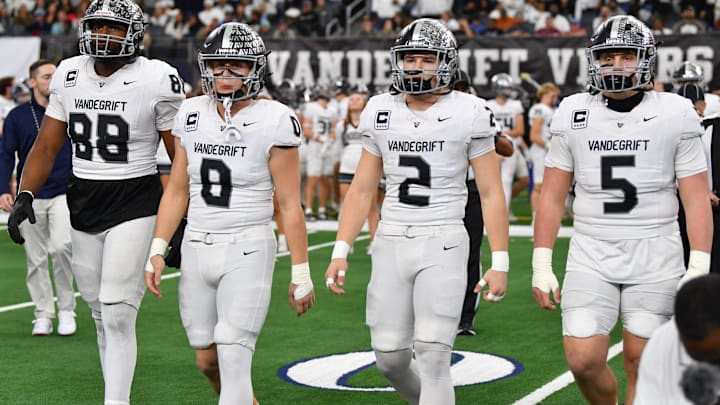 Austin Vandegrift's captains walk to midfield during the 6A DII UIL Texas State Football Championship game against Southlake Carroll on Saturday, December 21, 2024 at AT&T Stadium in Arlington. The Vipers are in the quarterfinals this year again. 