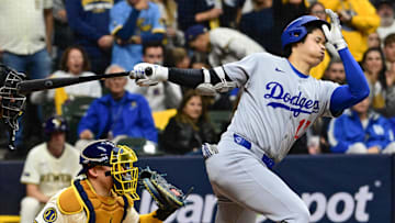 Oct 14, 2025; Milwaukee, Wisconsin, USA; Los Angeles Dodgers designated hitter Shohei Ohtani (17) strikes out against the Milwaukee Brewers in the eighth inning during game two of the NLCS round for the 2025 MLB playoffs at American Family Field. Mandatory Credit: Benny Sieu-Imagn Images