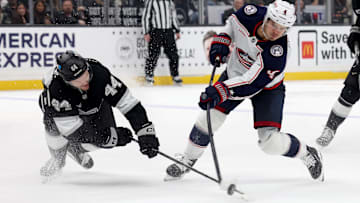 Nov 9, 2024; Los Angeles, California, USA; Columbus Blue Jackets center Cole Sillinger (4) shoots against Los Angeles Kings defenseman Mikey Anderson (44) during the third period at Crypto.com Arena. Mandatory Credit: Jason Parkhurst-Imagn Images