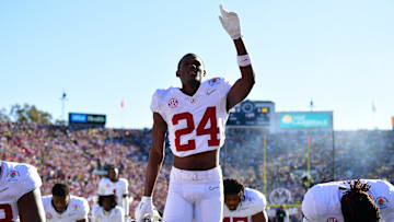 Jan 1, 2024; Pasadena, CA, USA; Alabama Crimson Tide wide receiver Emmanuel Henderson Jr. (24) prays with teammates in the endzone before the 2024 Rose Bowl college football playoff semifinal game against the Michigan Wolverines at Rose Bowl. Mandatory Credit: Gary A. Vasquez-Imagn Images