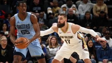 Feb 12, 2024; Memphis, Tennessee, USA; Memphis Grizzlies center Trey Jemison (55) handles the ball as New Orleans Pelicans center Jonas Valanciunas (17) defends during the second half at FedExForum.