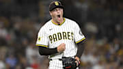 Sep 9, 2025; San Diego, California, USA; San Diego Padres relief pitcher Mason Miller (22) celebrates after striking out a batter during the eighth inning against the Cincinnati Reds at Petco Park. Mandatory Credit: Denis Poroy-Imagn Images