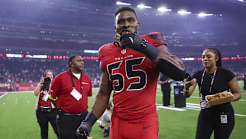Nov 20, 2025; Houston, Texas, USA; Houston Texans defensive end Danielle Hunter (55) eats chicken wings after the game against the Buffalo Bills at NRG Stadium. Mandatory Credit: Troy Taormina-Imagn Images