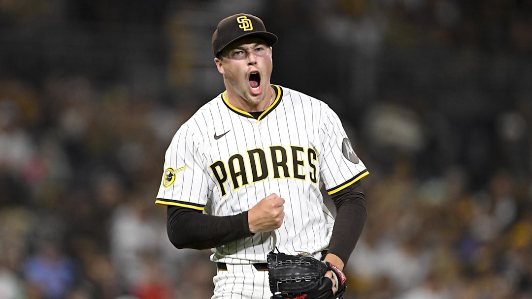 Sep 9, 2025; San Diego, California, USA; San Diego Padres relief pitcher Mason Miller (22) celebrates after striking out a batter during the eighth inning against the Cincinnati Reds at Petco Park. Mandatory Credit: Denis Poroy-Imagn Images