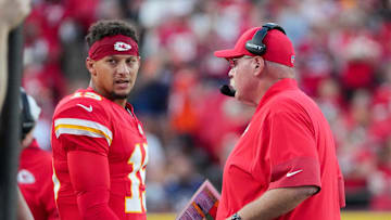 Aug 22, 2025; Kansas City, Missouri, USA; Kansas City Chiefs quarterback Patrick Mahomes (15) talks with head coach Andy Reid after a play against the Chicago Bears during the first half of the game at GEHA Field at Arrowhead Stadium. Mandatory Credit: Denny Medley-Imagn Images