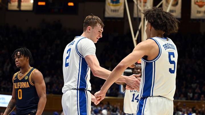 Feb 12, 2025; Durham, North Carolina, USA; Duke basketball forward Cooper Flagg (2) is congratulated by guard Tyrese Proctor (5) after scoring and being fouled during the second half against the California Golden Bears at Cameron Indoor Stadium. 