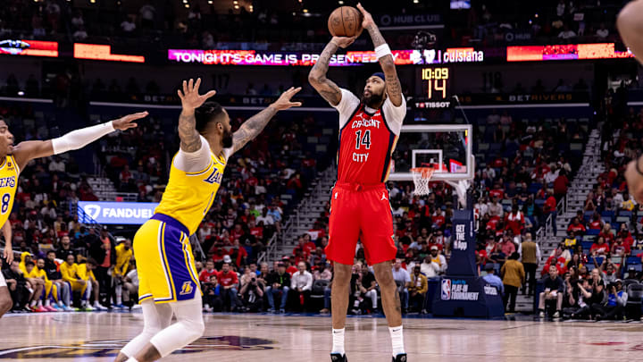 Apr 16, 2024; New Orleans, Louisiana, USA; New Orleans Pelicans forward Brandon Ingram (14) shoots a jump shot against the Los Angeles Lakers during the first half of a play-in game of the 2024 NBA playoffs at Smoothie King Center. Mandatory Credit: Stephen Lew-Imagn Images