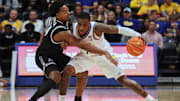 Oct 19, 2025; Pittsburgh, PA, USA;  Providence Friars guard Corey Floyd Jr. (14) defends against Pittsburgh Panthers guard Damarco Minor (7) during the second half at the Petersen Events Center. Mandatory Credit: Charles LeClaire-Imagn Images