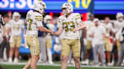 Nov 28, 2025; Atlanta, Georgia, USA; Georgia Tech Yellow Jackets kicker Aidan Birr (33) celebrates after a field goal with punter Marshall Nichols (47) against the Georgia Bulldogs in the fourth quarter at Mercedes-Benz Stadium. Mandatory Credit: Brett Davis-Imagn Images