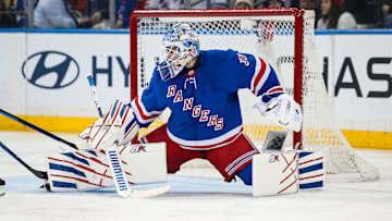 Mar 22, 2025; New York, New York, USA; New York Rangers goalie Igor Shesterkin (31) makes a save against the Vancouver Canucks during the second period at Madison Square Garden. Mandatory Credit: Danny Wild-Imagn Images