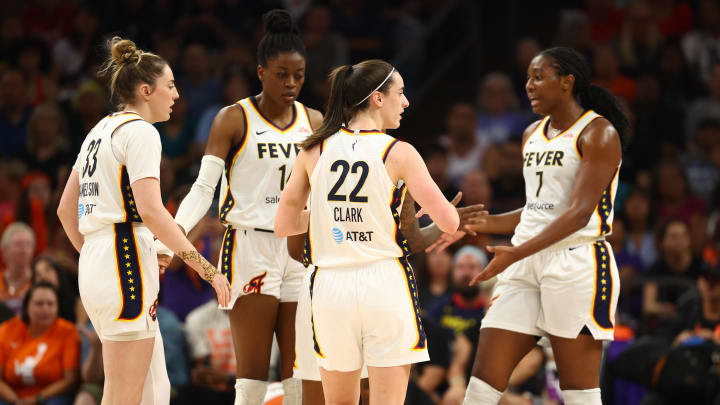 Indiana Fever guard Caitlin Clark in the huddle with forward Katie Lou Samuelson, center Temi Fagbenle and forward Aliyah Boston 