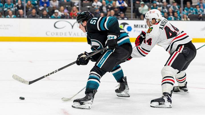 Mar 13, 2025; San Jose, California, USA; San Jose Sharks right wing Collin Graf (51) heads for goal during the third period against the Chicago Blackhawks at SAP Center at San Jose. Mandatory Credit: Bob Kupbens-Imagn Images