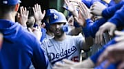 Los Angeles Dodgers catcher Austin Barnes celebrates in the dugout after scoring a run earlier this season.