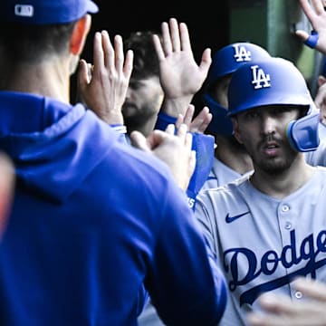 Los Angeles Dodgers catcher Austin Barnes celebrates in the dugout after scoring a run earlier this season.