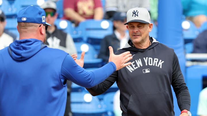Feb 22, 2025: New York Yankees manager Aaron Boone (17) and  Toronto Blue Jays manager John Schneider (14) greet before the game at TD Ballpark. 