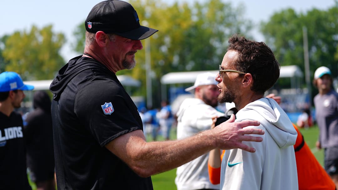 Detroit Lions coach Dan Campbell shakes hands with Miami Dolphins coach Mike McDaniels after a joint practice at Lions headquarters and training facility in Allen Park, Thursday, Aug. 14, 2025.