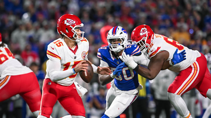 Nov 17, 2024; Orchard Park, New York, USA; Kansas City Chiefs quarterback Patrick Mahomes (15) is pressured by Buffalo Bills defensive end Greg Rousseau (50) who's being blocked by guard Trey Smith (65) in the third quarter at Highmark Stadium. Mandatory Credit: Mark Konezny-Imagn Images