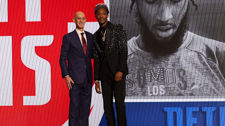 Jun 26, 2024; Brooklyn, NY, USA; Ron Holland II poses for photos with NBA commissioner Adam Silver after being selected in the first round by the Detroit Pistons in the 2024 NBA Draft at Barclays Center. Mandatory Credit: Brad Penner-Imagn Images