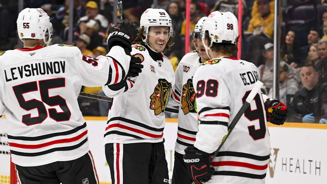 Jan 10, 2026; Nashville, Tennessee, USA;  Chicago Blackhawks left wing Tyler Bertuzzi (59) celebrates with his teammates after scoring a goal against the Nashville Predators during the second period at Bridgestone Arena. Mandatory Credit: Steve Roberts-Imagn Images