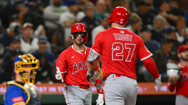 Sep 11, 2025; Seattle, Washington, USA; Los Angeles Angels shortstop Zach Neto (9) and designated hitter Mike Trout (27) celebrate after Trout hit a home run against the Seattle Mariners during the fifth inning at T-Mobile Park. Mandatory Credit: Steven Bisig-Imagn Images