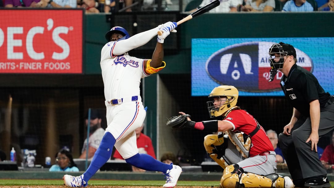 May 18, 2024; Arlington, Texas, USA; Texas Rangers right fielder Adolis Garcia (53) hits a solo home run during the sixth inning against the Los Angeles Angels at Globe Life Field. Mandatory Credit: Raymond Carlin III-USA TODAY Sports