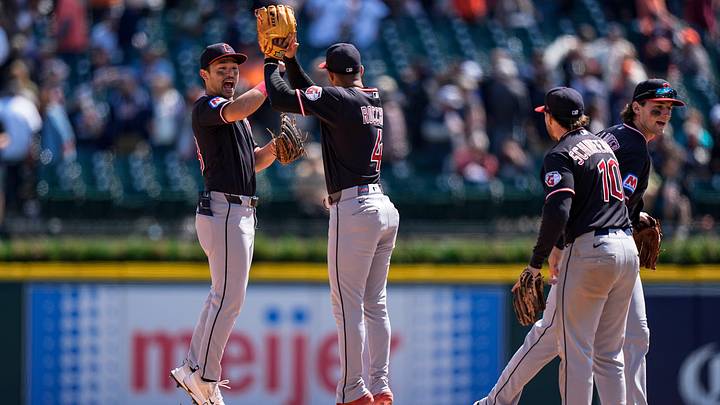 Cleveland Guardians center fielder Steven Kwan (38), left, and shortstop Brayan Rocchio (4) celebrate 3-1 win over Detroit Tigers at Comerica Park in Detroit on Thursday, May 21, 2026.