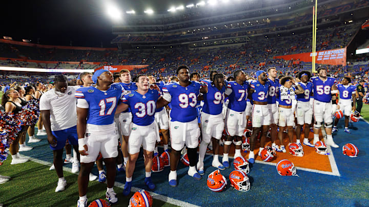 Florida Gators players Taylor Spierto, Michai Boireau, Austin Barber and other players before an NCAA college football game Florida Gators players Taylor Spierto, Michai Boireau, Austin Barber and other players before an NCAA college football game