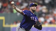 Texas Rangers starting pitcher Merrill Kelly (23) delivers a pitch during the third inning against the Houston Astros at Daikin Park.