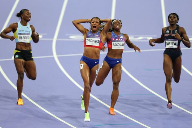 American sprinter Gabby Thomas celebrates after winning the women's 200-meter race at the Paris Olympics. 