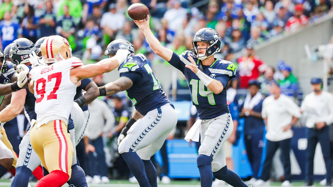 Sep 7, 2025; Seattle, Washington, USA; Seattle Seahawks quarterback Sam Darnold (14) passes against the San Francisco 49ers during the third quarter at Lumen Field. Mandatory Credit: Joe Nicholson-Imagn Images