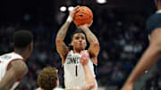 Jan 21, 2025; Storrs, Connecticut, USA; UConn Huskies guard Solo Ball (1) shoots the ball against Butler Bulldogs guard Finley Bizjack (13) in the first half at Harry A. Gampel Pavilion. Mandatory Credit: David Butler II-Imagn Images
