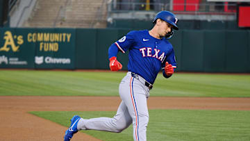 Sep 25, 2024; Oakland, California, USA; Texas Rangers center fielder Wyatt Langford (36) rounds third base on a two-run home run against the Oakland Athletics during the first inning at Oakland-Alameda County Coliseum. Mandatory Credit: Kelley L Cox-Imagn Images