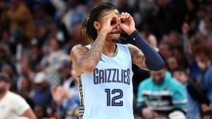 Memphis Grizzlies guard Ja Morant (12) reacts after an assist during the second half against the San Antonio Spurs at FedEx Forum. Mandatory Credit: 