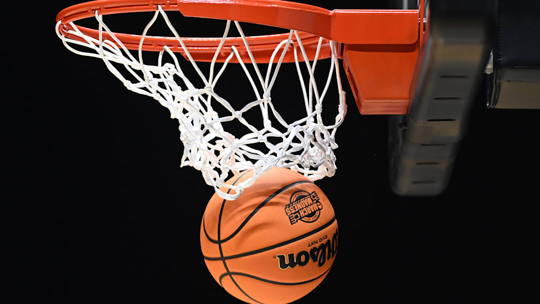 The March Madness logo is seen on a basketball during the NCAA Tournament. 