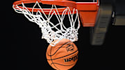 The March Madness logo is seen on a basketball during the NCAA Tournament. 