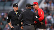 May 5, 2025; Atlanta, Georgia, USA; Cincinnati Reds manager Terry Francona (77) talks to umpire Chris Segal (96) and umpire Alan Porter (64) against the Atlanta Braves in the third inning at Truist Park. Mandatory Credit: Brett Davis-Imagn Images