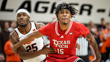 Feb 15, 2025; Stillwater, Oklahoma, USA; Texas Tech Red Raiders forward JT Toppin (15) blocks out Oklahoma State Cowboys forward Robert Jennings II (25) during the first half at Gallagher-Iba Arena. Mandatory Credit: William Purnell-Imagn Images