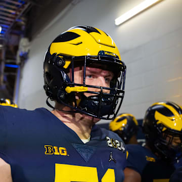 Jan 8, 2024; Houston, TX, USA; Michigan Wolverines offensive lineman Evan Link (71) against the Washington Huskies during the 2024 College Football Playoff national championship game at NRG Stadium. Mandatory Credit: Mark J. Rebilas-Imagn Images