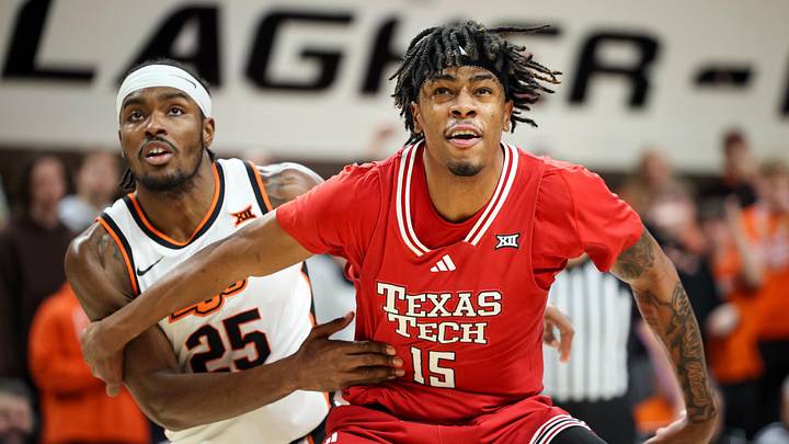 Feb 15, 2025; Stillwater, Oklahoma, USA; Texas Tech Red Raiders forward JT Toppin (15) blocks out Oklahoma State Cowboys forward Robert Jennings II (25) during the first half at Gallagher-Iba Arena. Mandatory Credit: William Purnell-Imagn Images