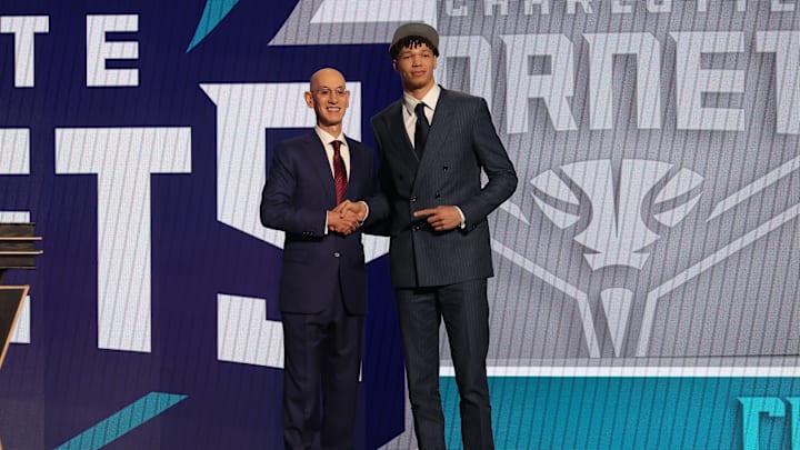 Jun 26, 2024; Brooklyn, NY, USA; Tidjane Salaun poses for photos with NBA commissioner Adam Silver after being selected in the first round by the Charlotte Hornets in the 2024 NBA Draft at Barclays Center. Mandatory Credit: Brad Penner-Imagn Images