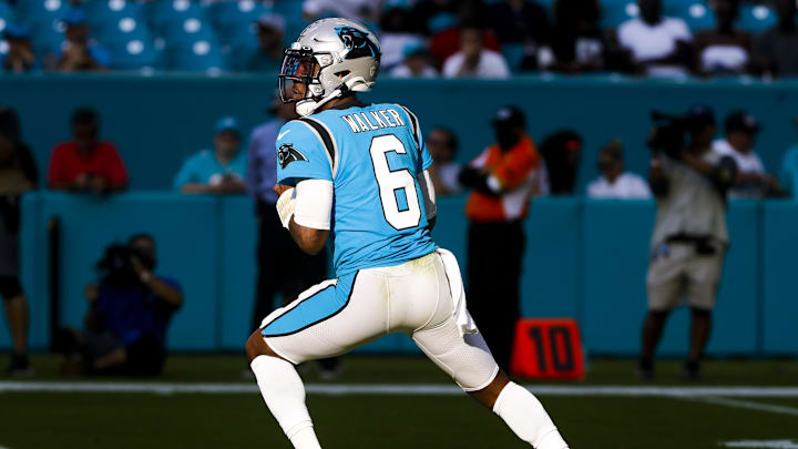 Nov 28, 2021; Miami Gardens, Florida, USA; Carolina Panthers quarterback P.J. Walker (6) looks on for a passing option against the Miami Dolphins during the fourth quarter at Hard Rock Stadium. Mandatory Credit: Sam Navarro-Imagn Images Nov 28, 2021; Miami Gardens, Florida, USA; Carolina Panthers quarterback P.J. Walker (6) looks on for a passing option against the Miami Dolphins during the fourth quarter at Hard Rock Stadium. Mandatory Credit: Sam Navarro-Imagn Images