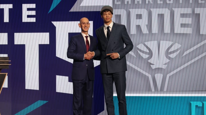 Jun 26, 2024; Brooklyn, NY, USA; Tidjane Salaun poses for photos with NBA commissioner Adam Silver after being selected in the first round by the Charlotte Hornets in the 2024 NBA Draft at Barclays Center. Mandatory Credit: Brad Penner-USA TODAY Sports