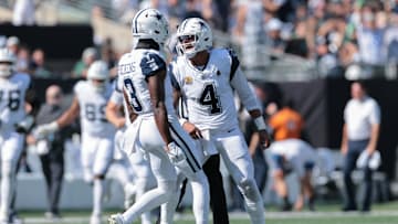 Oct 5, 2025; East Rutherford, New Jersey, USA; Dallas Cowboys quarterback Dak Prescott (4) reacts with wide receiver George Pickens (3) after throwing a touchdown pass against the New York Jets during the first half at MetLife Stadium. Mandatory Credit: Vincent Carchietta-Imagn Images