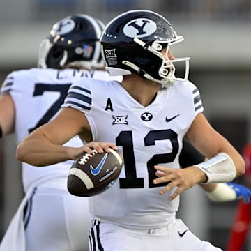 Sep 6, 2024; Dallas, Texas, USA; Brigham Young Cougars quarterback Jake Retzlaff (12) passes the ball against the Southern Methodist Mustangs during the first half at Gerald J. Ford Stadium.