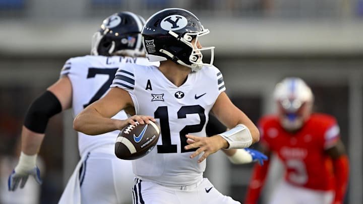 Sep 6, 2024; Dallas, Texas, USA; Brigham Young Cougars quarterback Jake Retzlaff (12) passes the ball against the Southern Methodist Mustangs during the first half at Gerald J. Ford Stadium.