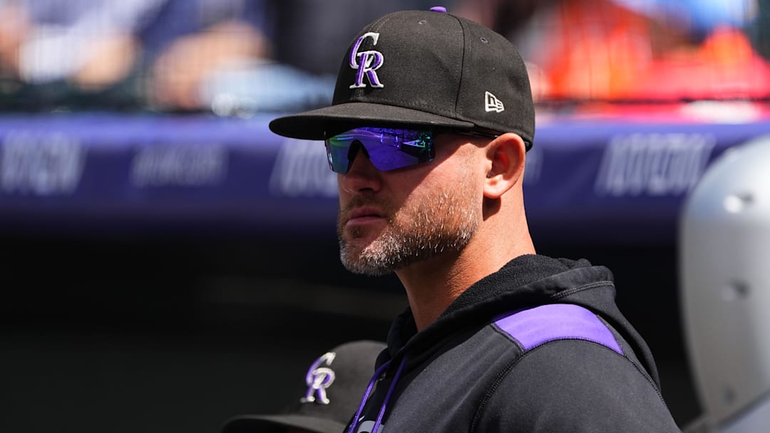 Colorado Rockies manager Warren Schaeffer (4) looks on from the dugout. 
