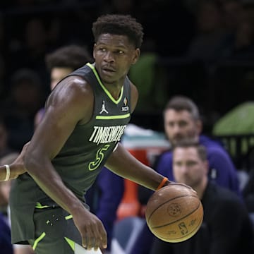 Nov 7, 2025; Minneapolis, Minnesota, USA; Minnesota Timberwolves guard Anthony Edwards (5) dribbles the ball as Utah Jazz guard Isaiah Collier (8) plays defense in the first half at Target Center. Mandatory Credit: Jesse Johnson-Imagn Images