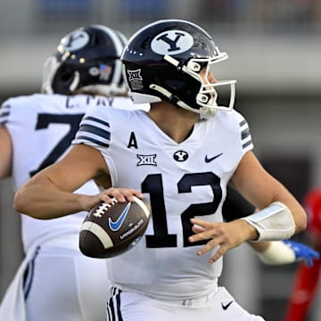 Sep 6, 2024; Dallas, Texas, USA; Brigham Young Cougars quarterback Jake Retzlaff (12) passes the ball against the Southern Methodist Mustangs during the first half at Gerald J. Ford Stadium.