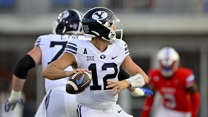 Sep 6, 2024; Dallas, Texas, USA; Brigham Young Cougars quarterback Jake Retzlaff (12) passes the ball against the Southern Methodist Mustangs during the first half at Gerald J. Ford Stadium.