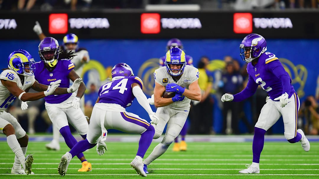 Oct 24, 2024; Inglewood, California, USA; Los Angeles Rams wide receiver Cooper Kupp (10) runs the ball against Minnesota Vikings safety Camryn Bynum (24) and cornerback Stephon Gilmore (2) during the second half at SoFi Stadium. Mandatory Credit: Gary A. Vasquez-Imagn Images Oct 24, 2024; Inglewood, California, USA; Los Angeles Rams wide receiver Cooper Kupp (10) runs the ball against Minnesota Vikings safety Camryn Bynum (24) and cornerback Stephon Gilmore (2) during the second half at SoFi Stadium. Mandatory Credit: Gary A. Vasquez-Imagn Images